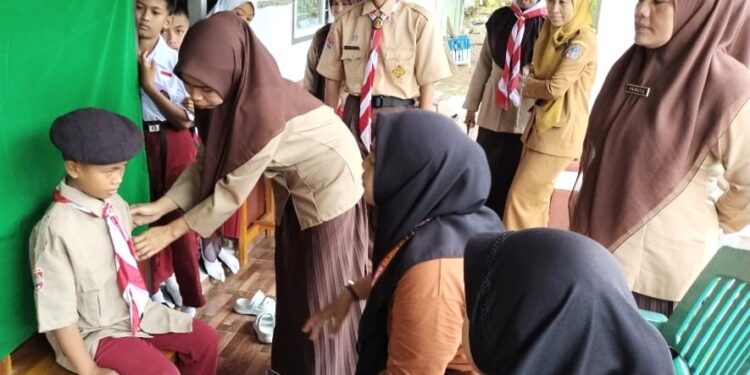 Langkah Awal Menuju Kesempurnaan: Pramuka SD Inpres 4/82 Bulu Ulaweng Lakukan Perekaman KTA Pramuka Nasional
