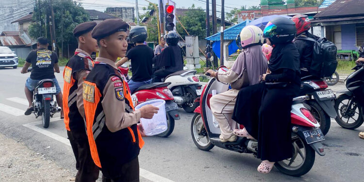 Satgas Pramuka Peduli HST Bantu Amankan Lalu Lintas Pawai Takbir Keliling Idul Fitri 1447 H