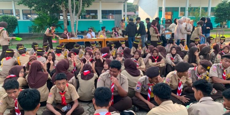 Semangat Persaudaraan dan Pengabdian Menggema dalam Peringatan Hari Lahir Ambalan Tomau ke-XX di SMAN 19 Bone.